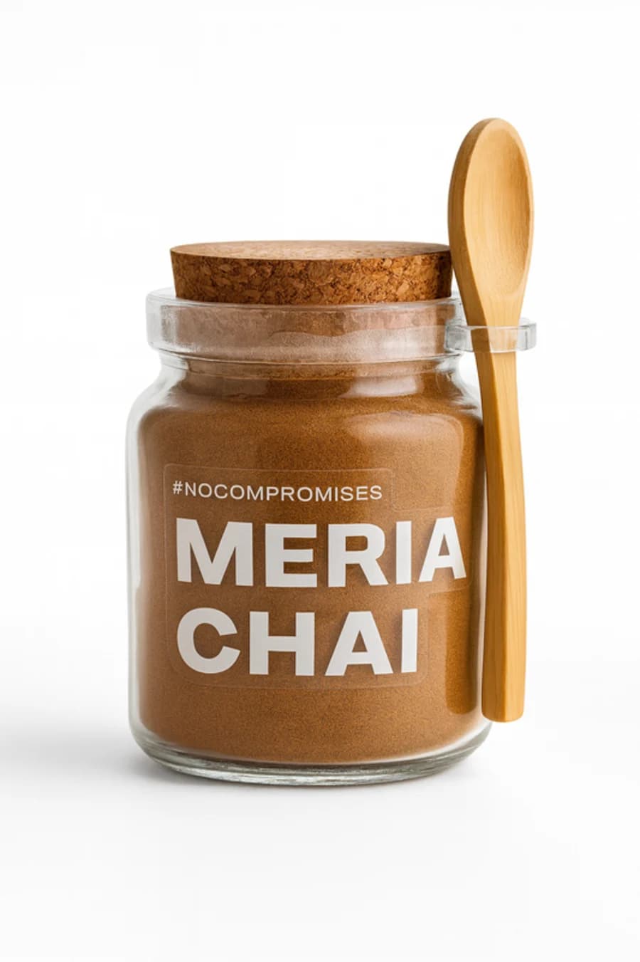 A glass jar of Meria Chai powder with a cork lid and a wooden spoon clipped to the side